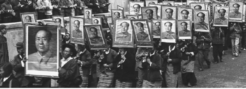 Women with portraits of Mao march past leaders at a rally in Lhasa, 1966