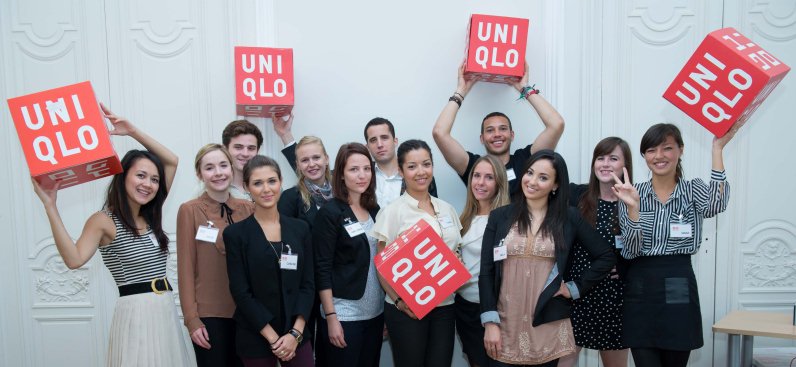 Uniqlo crew with signs